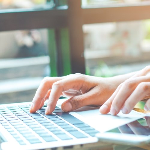 Person typing on a laptop