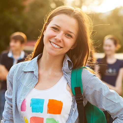 Smiling teenage girl with backpack